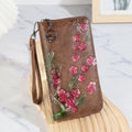 Embossed floral pattern Chinese style handbag with zipper closure in black colour
