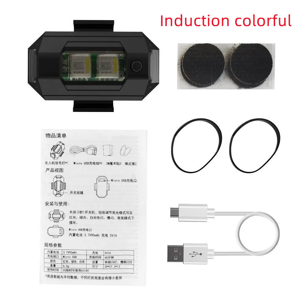 Drone signal light with RGB LED strobe, Type-C cable, fixing tape and ring belts on a table