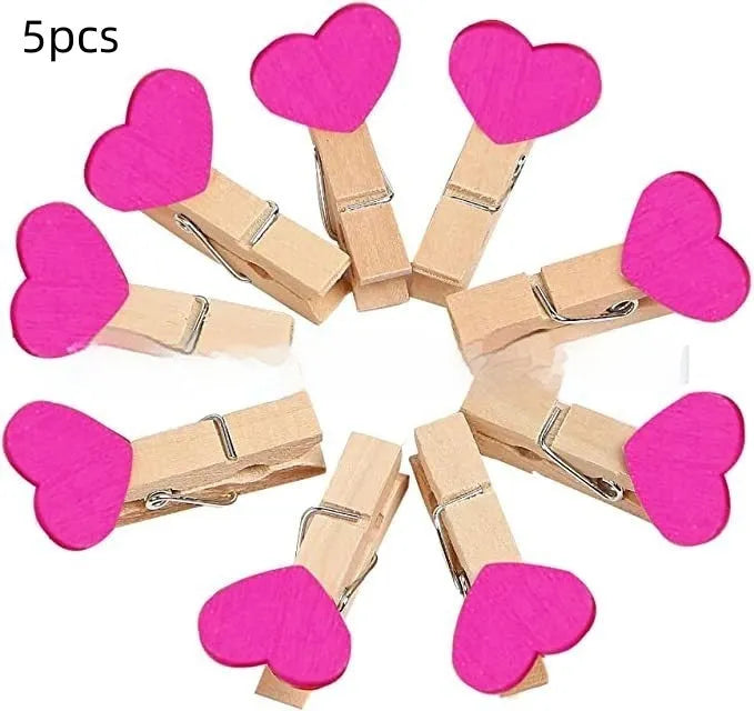 Pack of five solid wood heart-shaped clips in assorted colours on a white background.