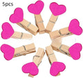 Pack of five solid wood heart-shaped clips in assorted colours on a white background.