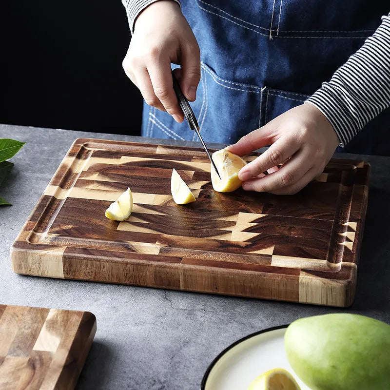 Brown acacia wood parquet cutting board with 3cm thickness on kitchen counter