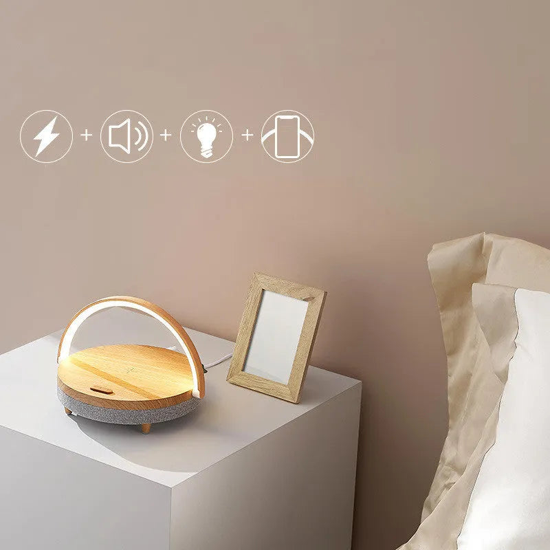 Wireless charging LED night light with Bluetooth speaker and phone holder in marble pattern or wood grain finish