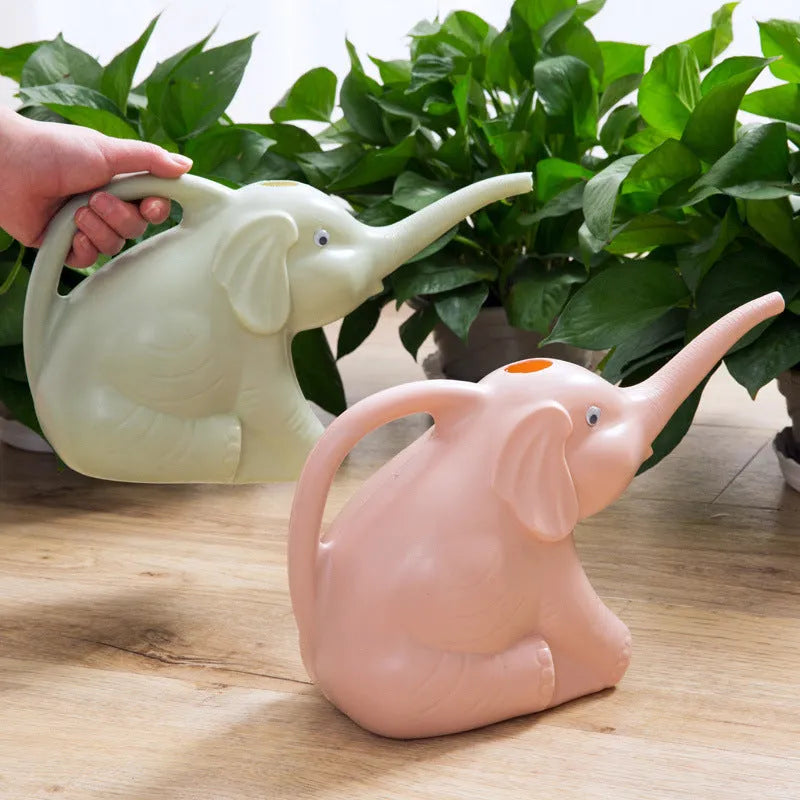 Pink elephant-shaped children's watering can with a long nozzle and baby bottle handle.