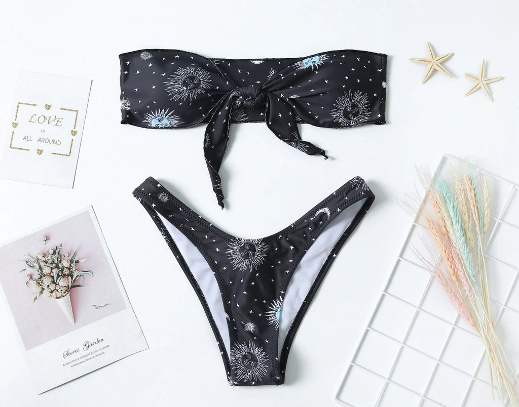 Black one-piece swimsuit with bikini print and a backless split tube top design.