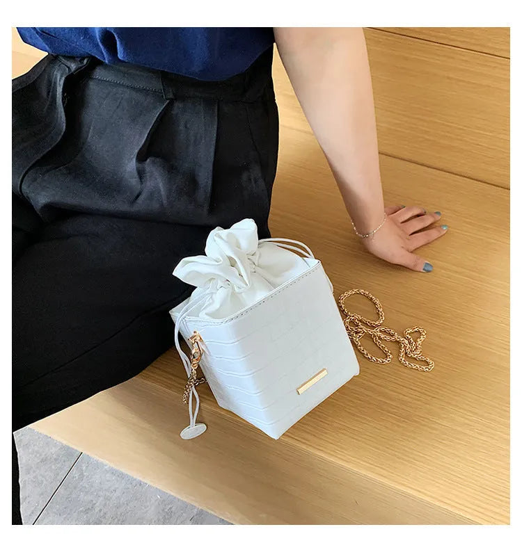 Women's small bucket messenger bag with detachable chain strap in multiple colour options