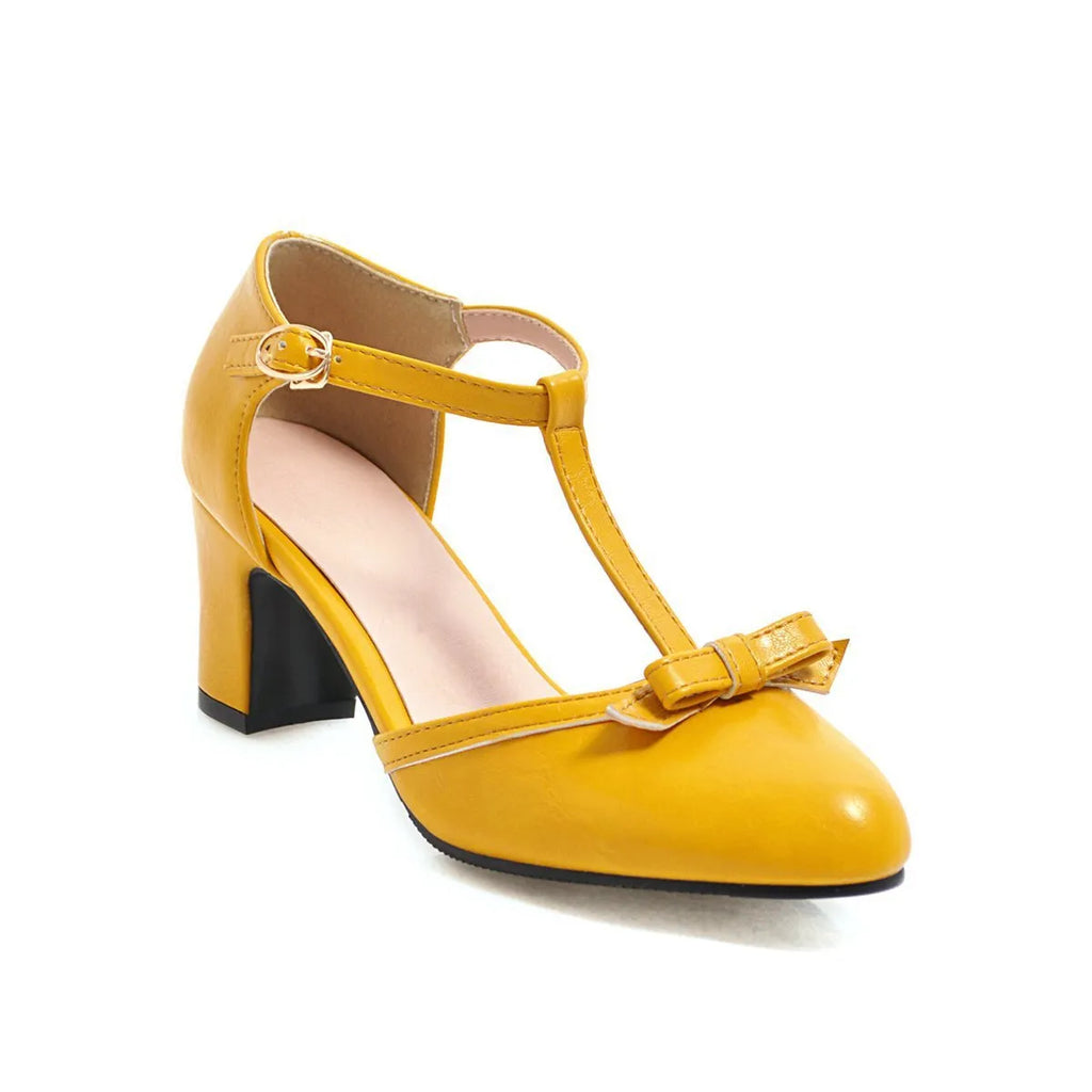 Yellow women's sandals with a chunky 6.5cm heel, bow tie detail, and buckle strap on a round toe.