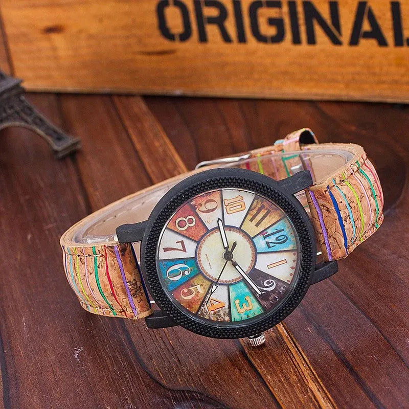Vintage style women's leather strap quartz watch with round 37mm dial and stainless steel buckle.
