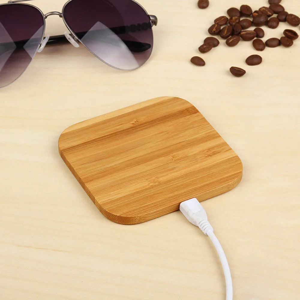 Brown wooden bamboo square 5W QI wireless charger on a desk