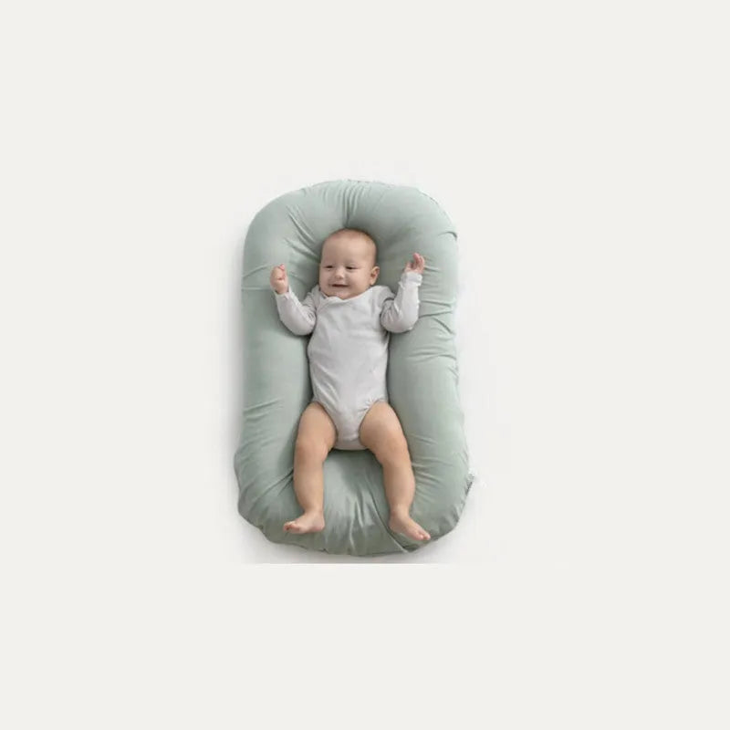 Beige portable cotton baby nest crib for newborn, measuring 75cm by 45cm.