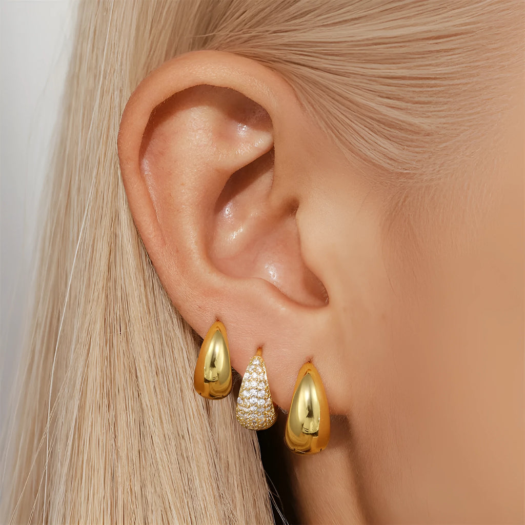 Geometric brass diamond earclip earrings with round accents in golden electroplated finish