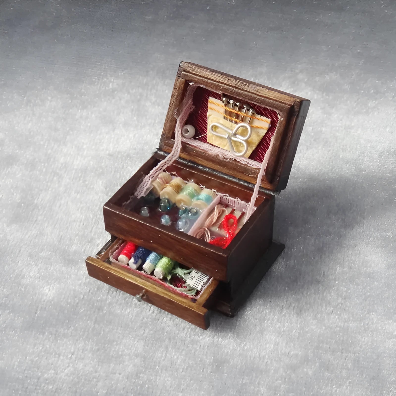 Miniature European-style wooden sewing box ornament with birch construction measuring 2.2cm by 3.4cm
