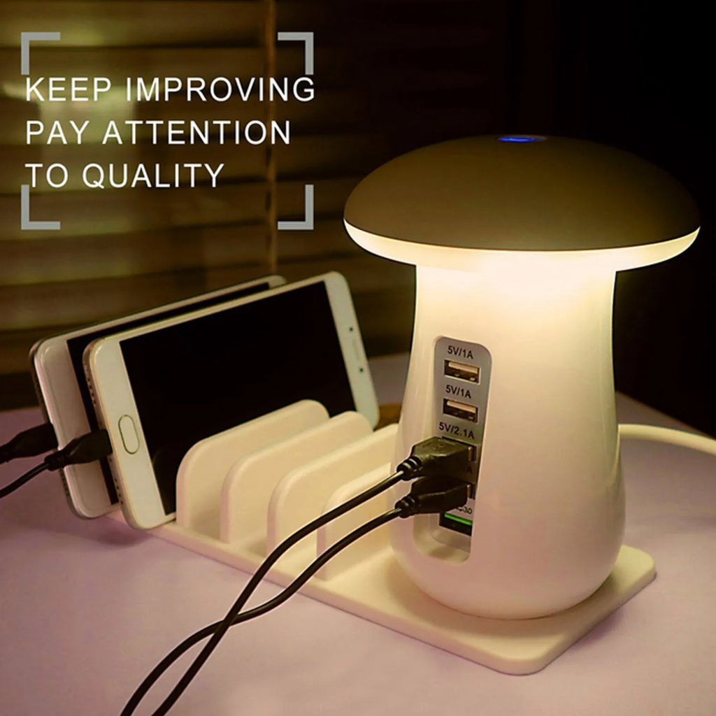 White mushroom-shaped USB charging dock station with five ports and a built-in LED night lamp on a desk.