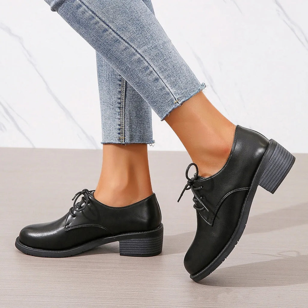Black women's work shoes with thick chunky heel, PU leather upper, and rubber sole