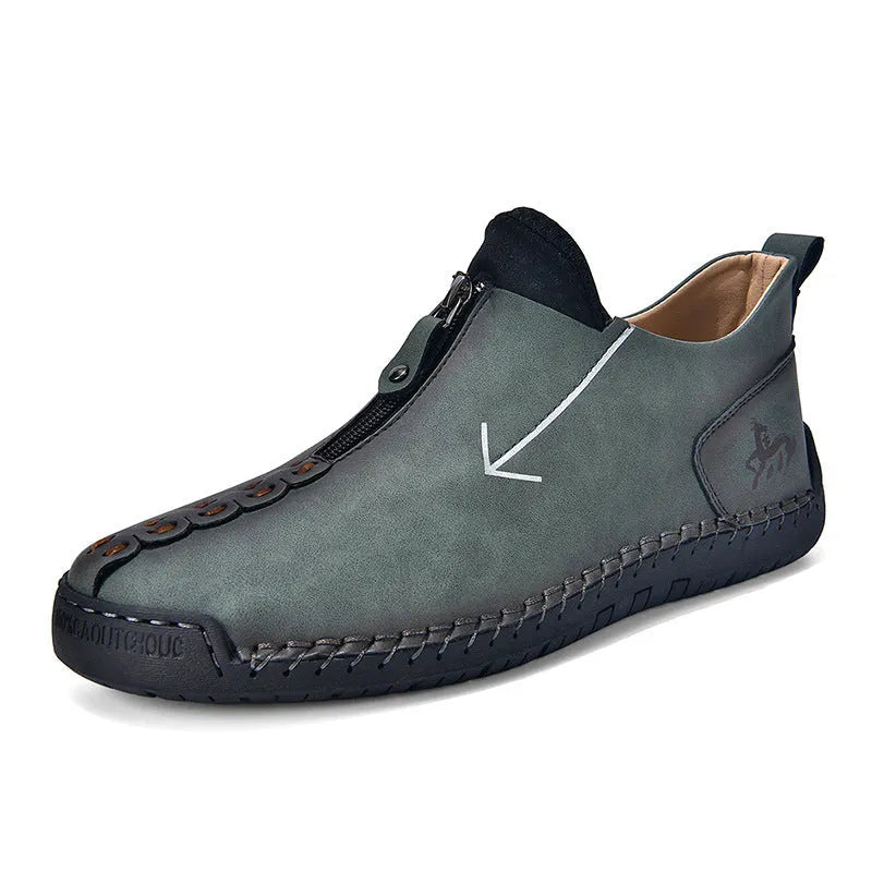 Men's brown leather-look zip-up martin boots with a round toe and rubber sole on a white background.