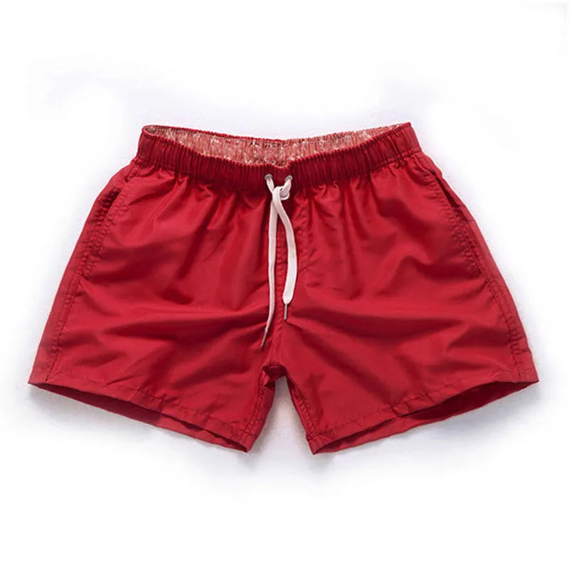 Men's straight leg beach shorts in polyester fabric available in multiple colours and sizes S to 4XL