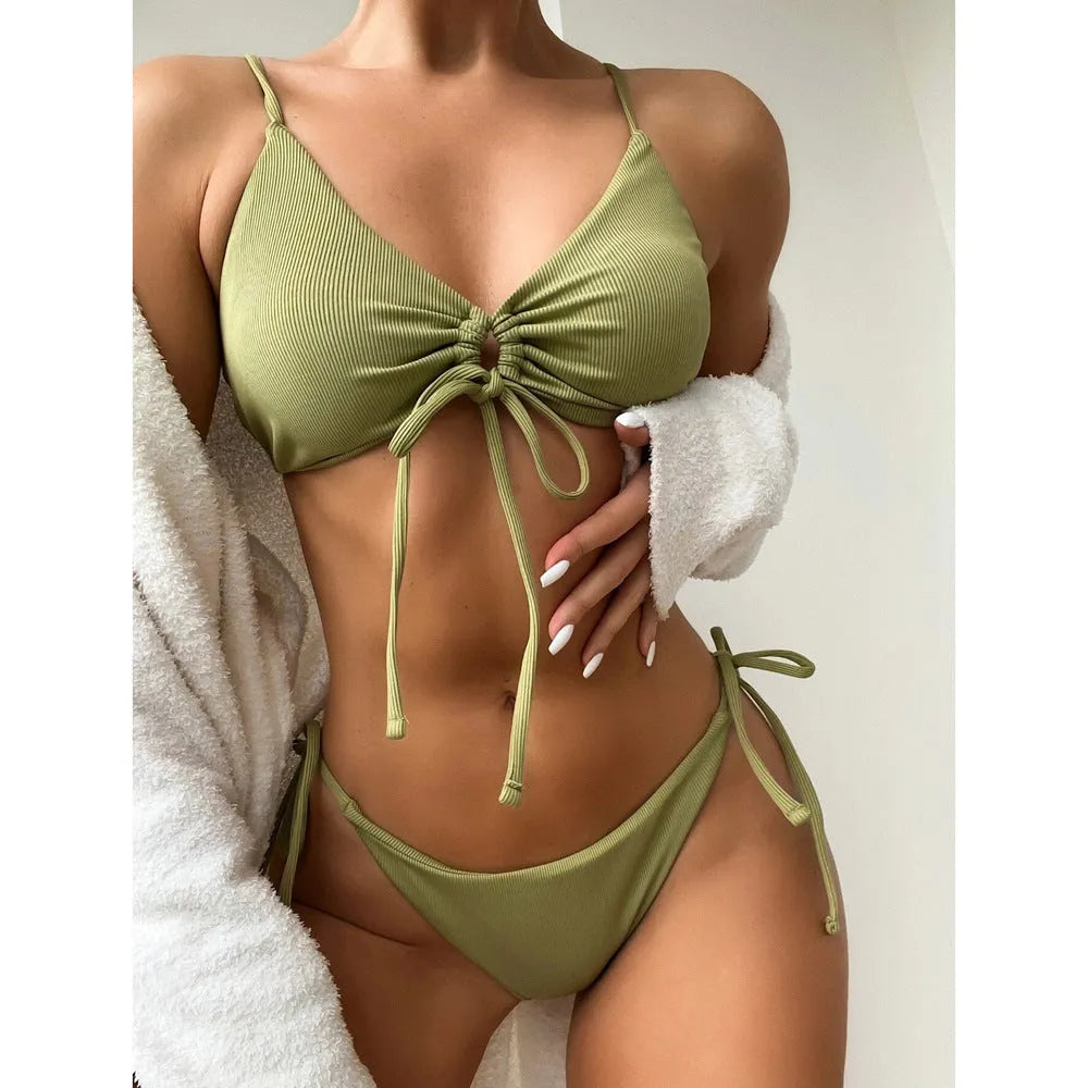 Women's solid color drawstring bikini set in backless brief style made of quick-drying nylon and spandex