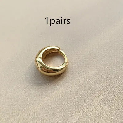 Women's geometric water drop earrings in gold and silver with minimalist round design