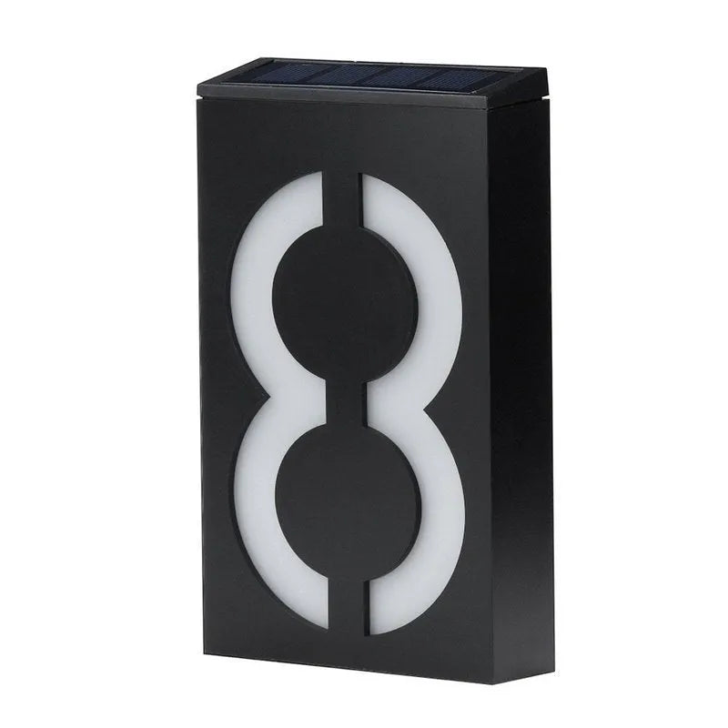 Solar powered house number light with 6 LEDs and IP65 waterproof rating mounted on an exterior wall.