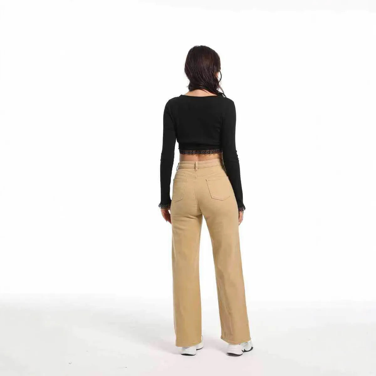 Women's apricot straight wide-leg high-waisted cotton trousers on a hanger.
