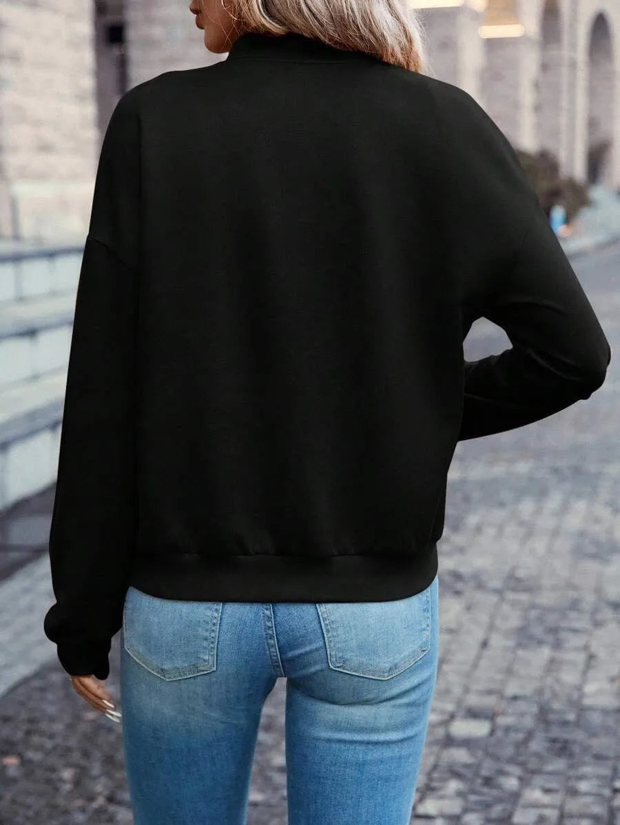 Black women's casual zip-front jacket with long sleeves and faux pockets.