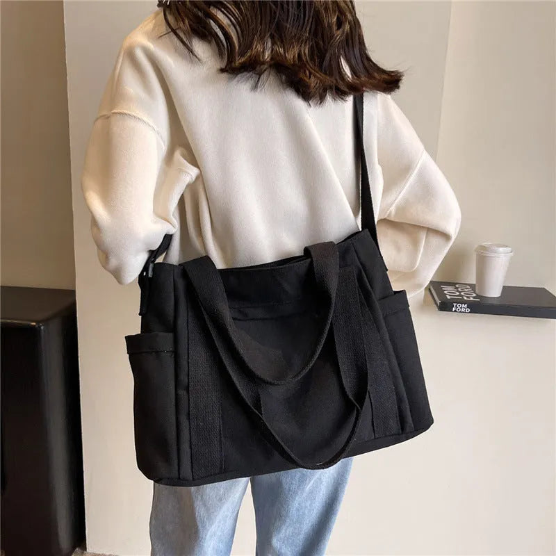 Women's polyester canvas shoulder bag with large capacity and mobile phone pocket in solid colour