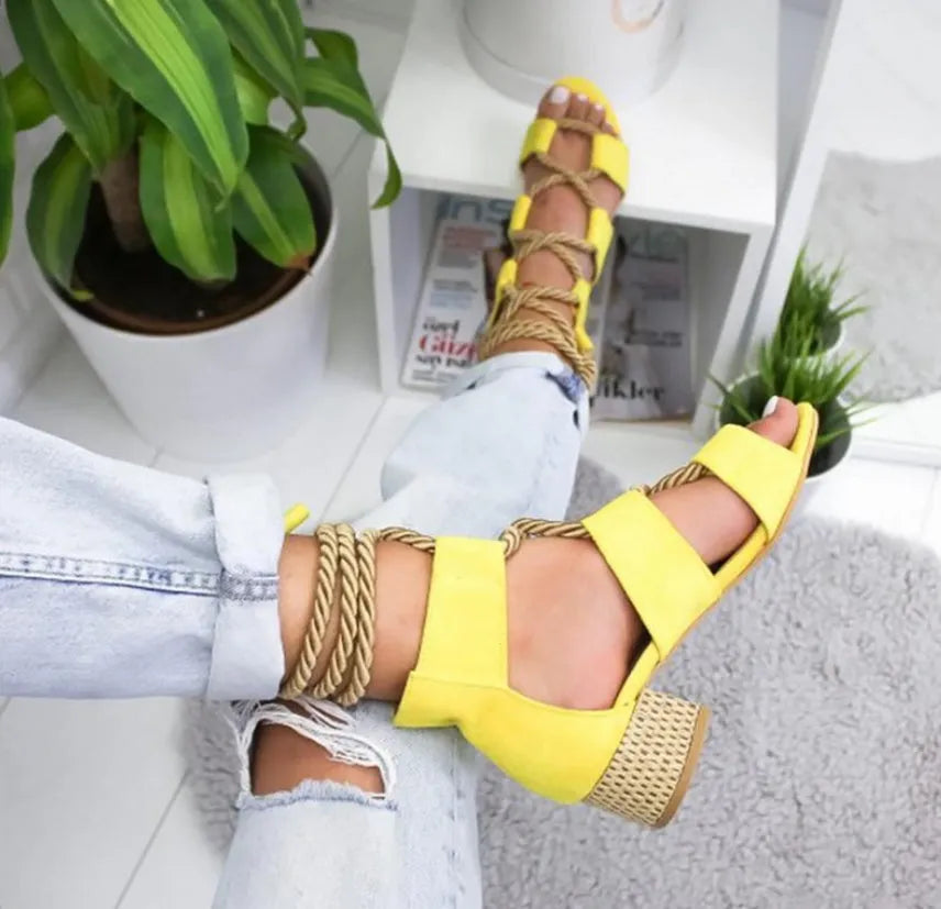 Women's beige suede sandals with front strap, fish mouth toe, and a colour-matching middle heel
