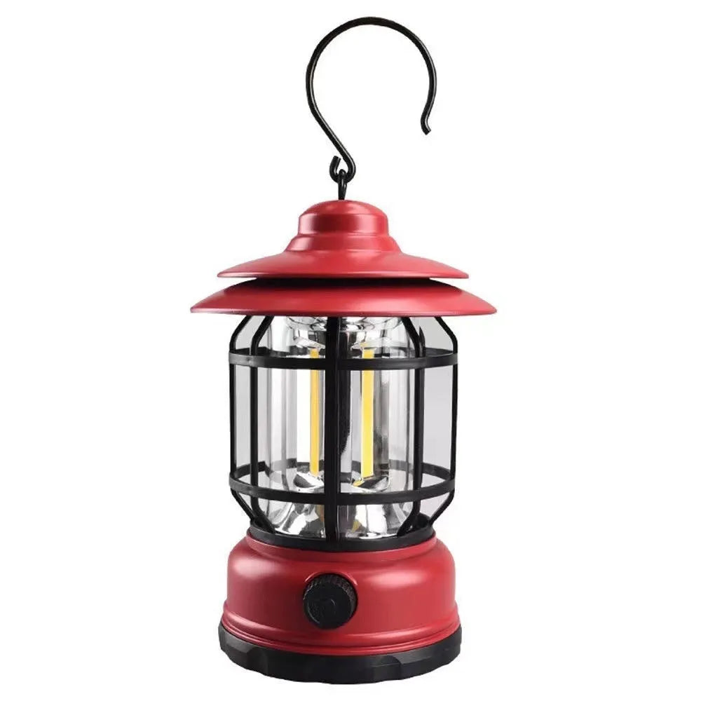 Dark green portable camping lantern with super bright LEDs, shown with a dry battery for scale.