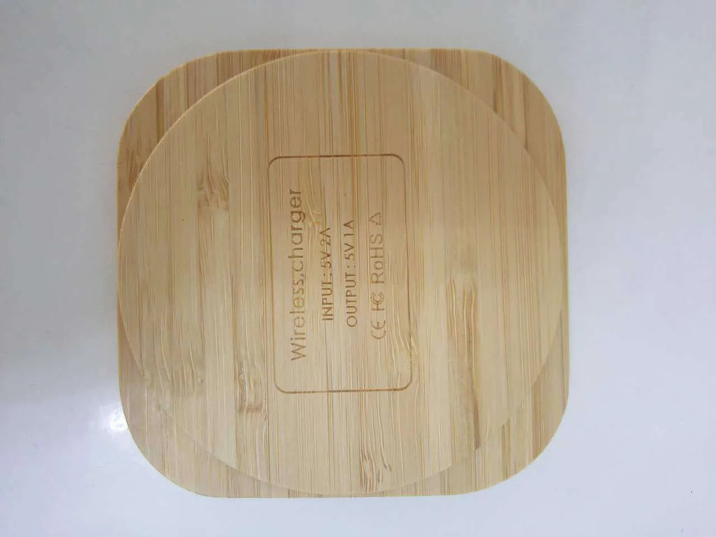 Brown wooden bamboo square 5W QI wireless charger on a desk