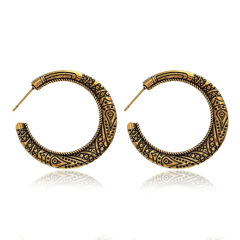 Vintage engraved C-shaped alloy earrings in bronze finish with detailed surface patterns