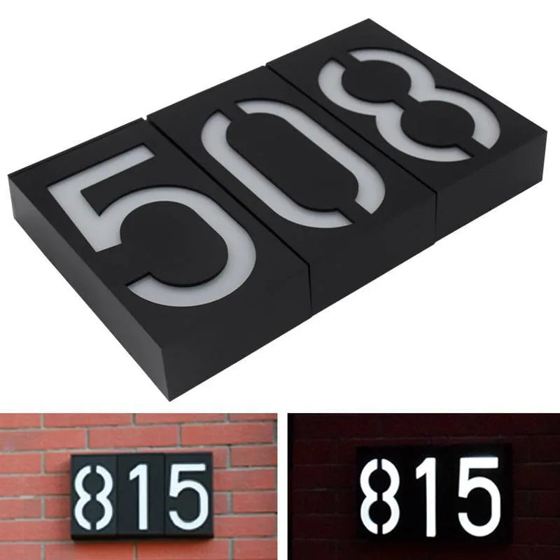 Solar powered house number light with 6 LEDs and IP65 waterproof rating mounted on an exterior wall.
