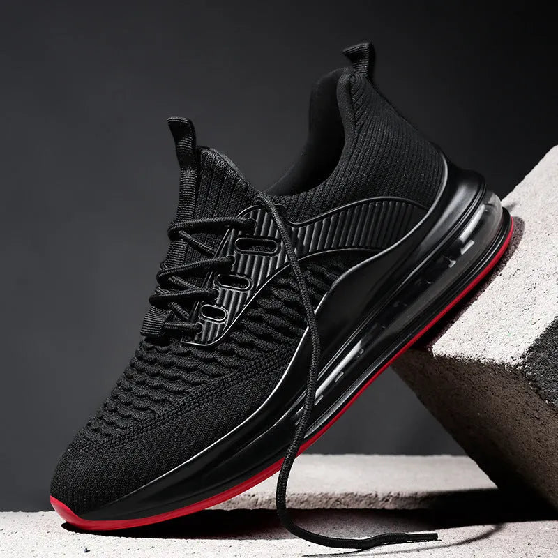 Men's low-top black mesh running shoes with lace-up front and rubber sole.