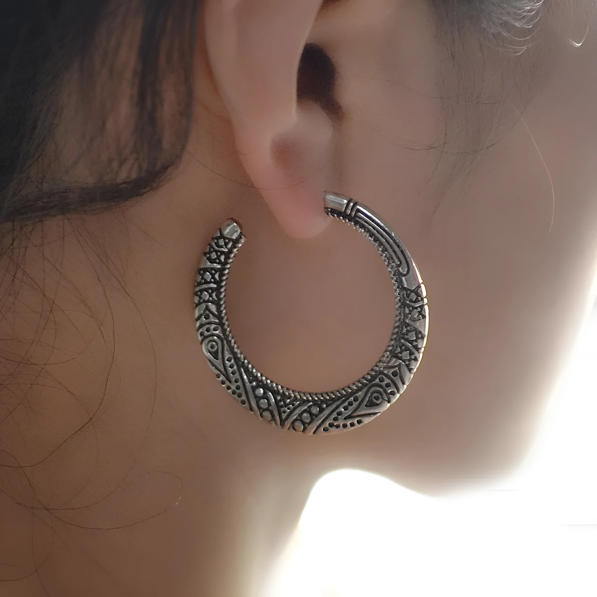 Vintage engraved C-shaped alloy earrings in bronze finish with detailed surface patterns