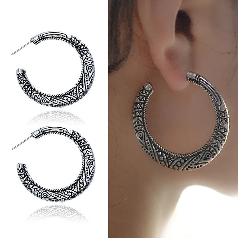 Vintage engraved C-shaped alloy earrings in bronze finish with detailed surface patterns