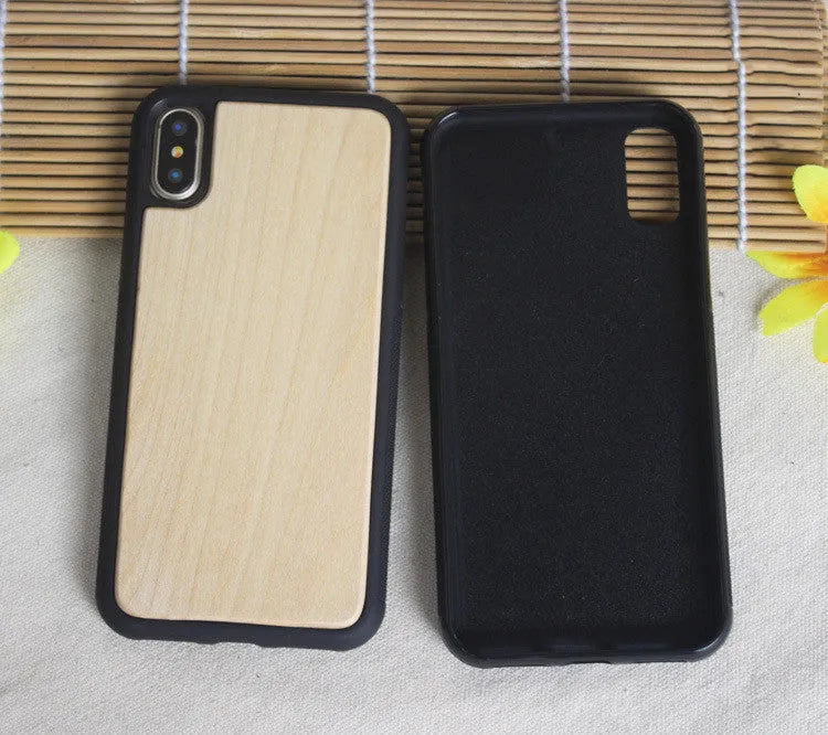 Wooden iPhone case with carbonized bamboo back and black TPU bumper frame on a table.