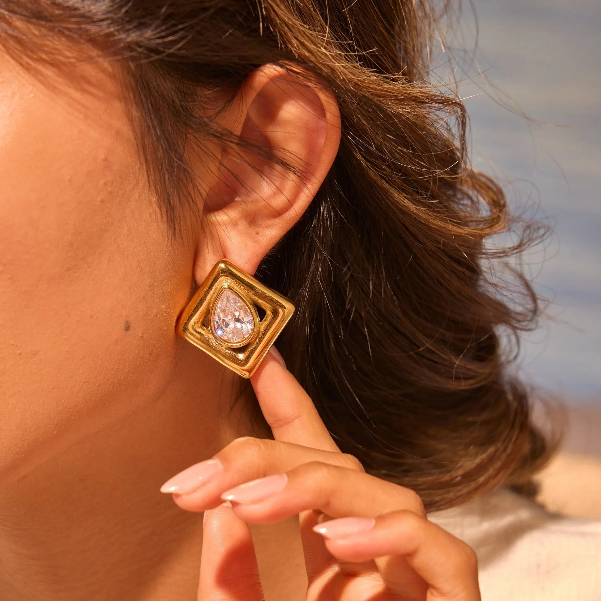 Gold stud earrings with geometric water drop zircon stones on stainless steel