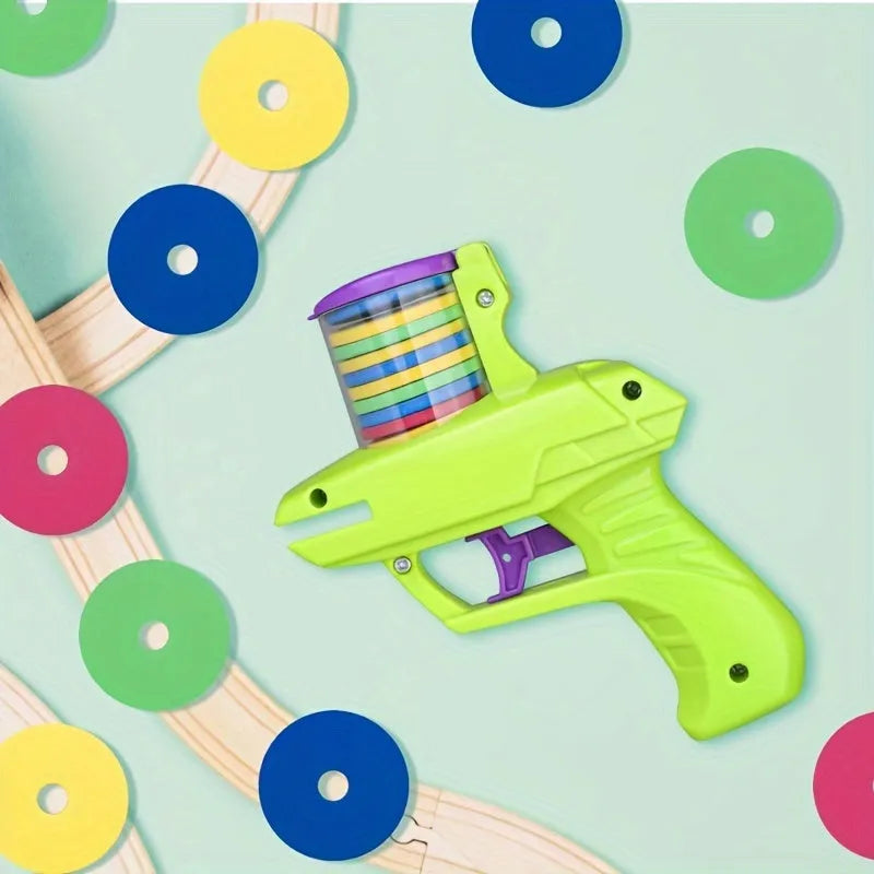 Interactive cat toy launcher with foam disc in green or purple colour