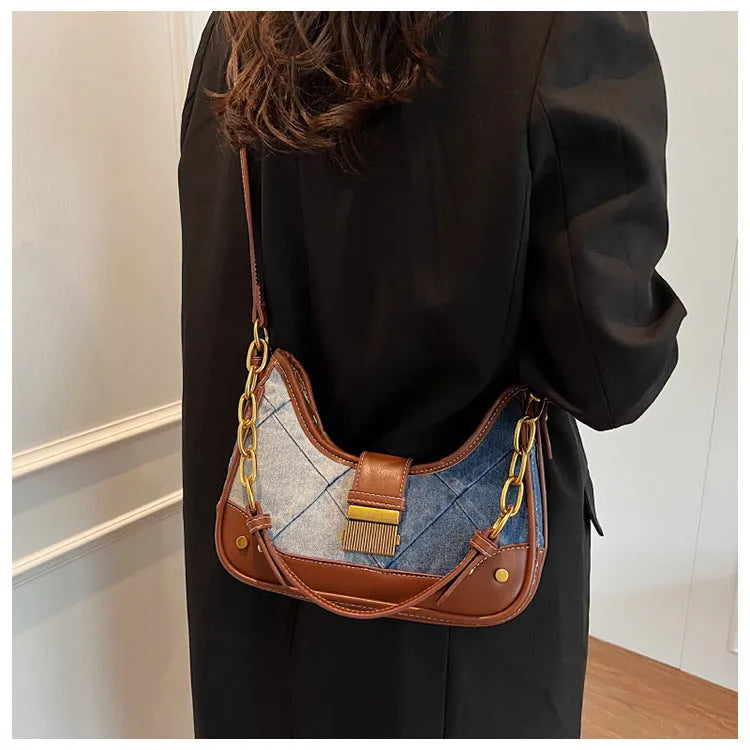 Brown denim women's shoulder bag with diamond mesh panel and chain strap showing bucket shape