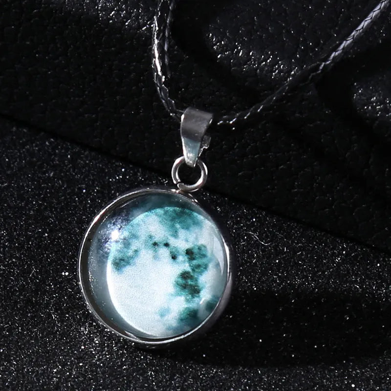 Alloy necklace with luminous glass pendant showing Christmas moon night sky and constellation design.