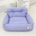 Blue plaid fabric car-mounted dog travel nest for small or medium dogs on a car seat