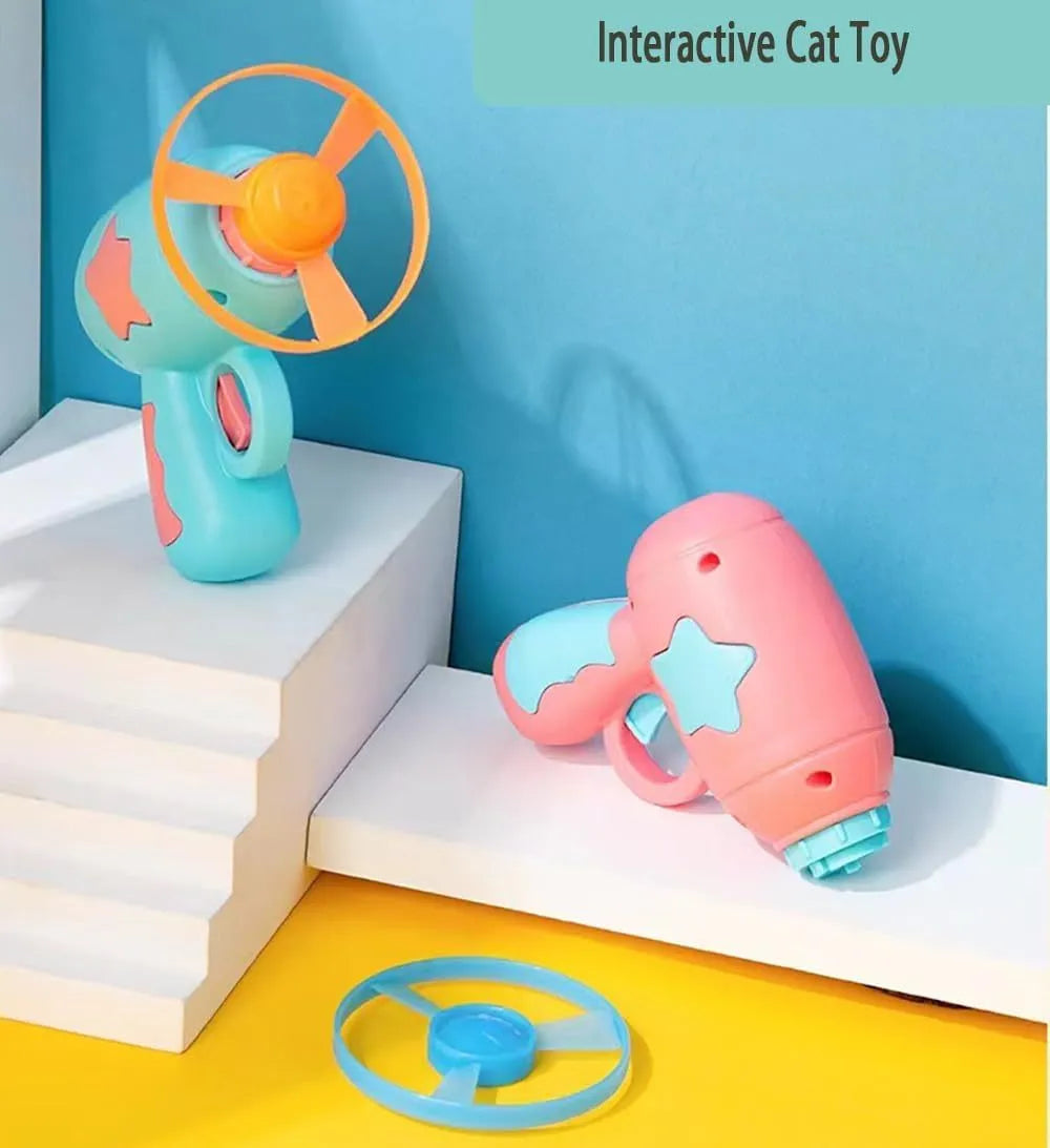 Blue plastic cat toy gun with spinning Frisbee launcher for indoor feline entertainment