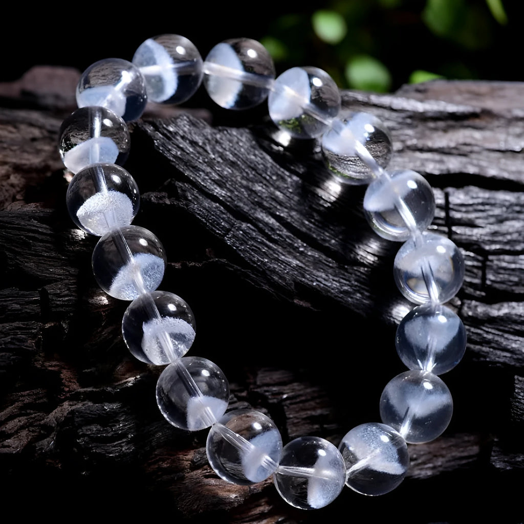 White crystal pyramid bracelet with natural ghost charm and Ruyi symbol detail on wrist