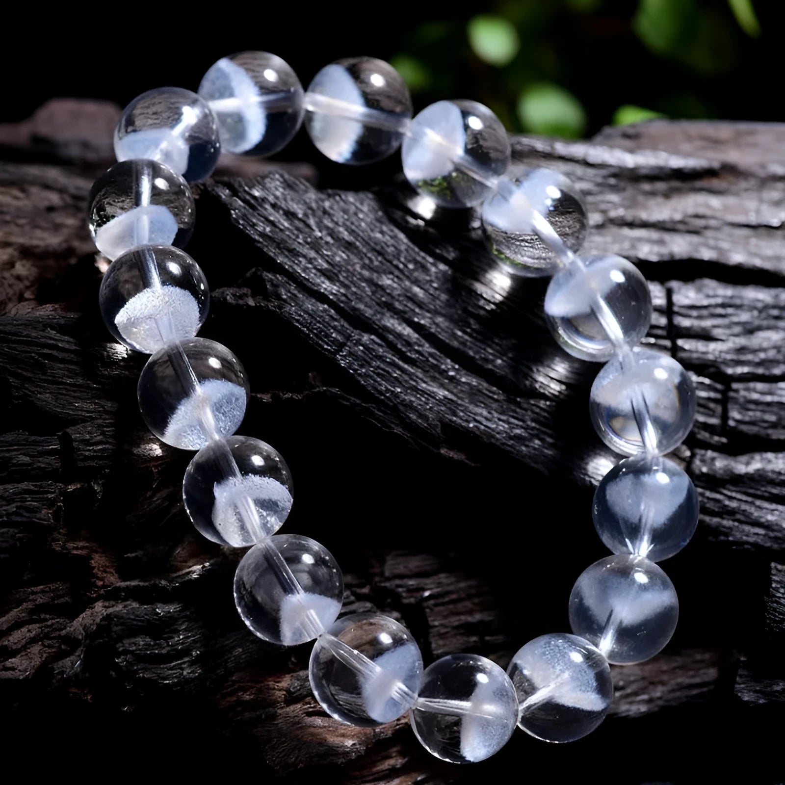 White crystal pyramid bracelet with natural ghost charm and Ruyi symbol detail on wrist