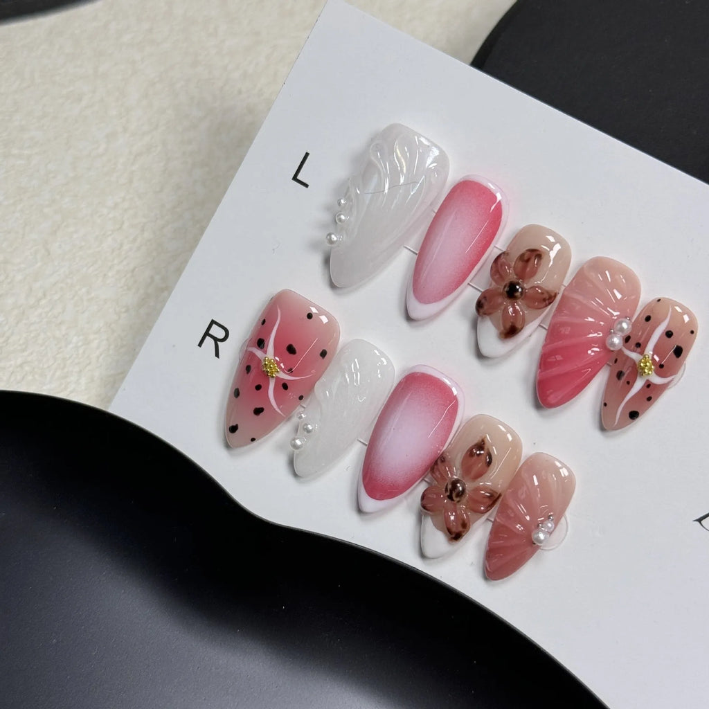 Hand-painted three-dimensional carved nail art patches in embossed candy colours, showing almond shape.