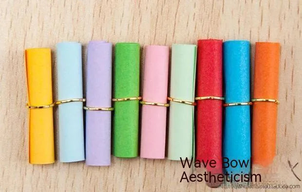 Assorted colour mini paper scrolls with punched holes for drift bottle notes and crafts.