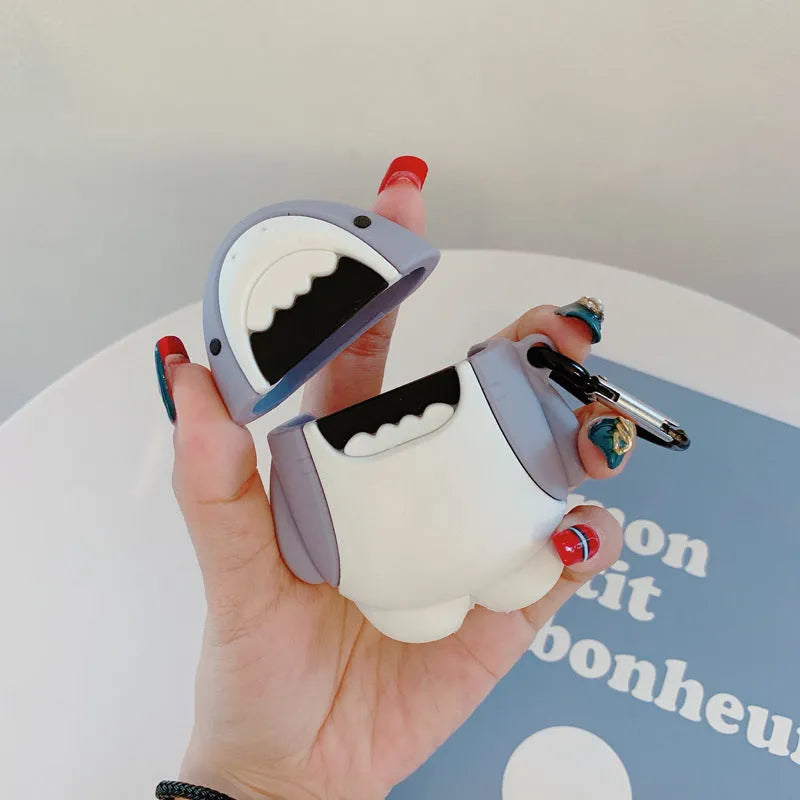 Silicone protective cover for Apple AirPods 1 and 2 charging case with clip-on shark fin decoration.