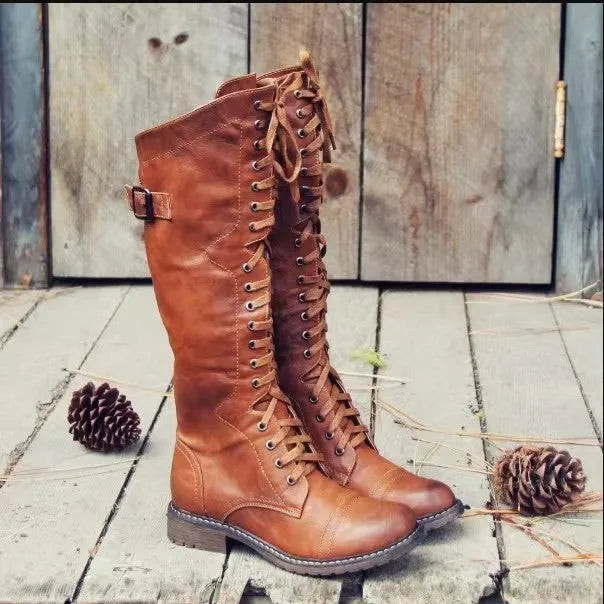Chunky low heel high leg boots in black, brown, and wine red with rounded toe.