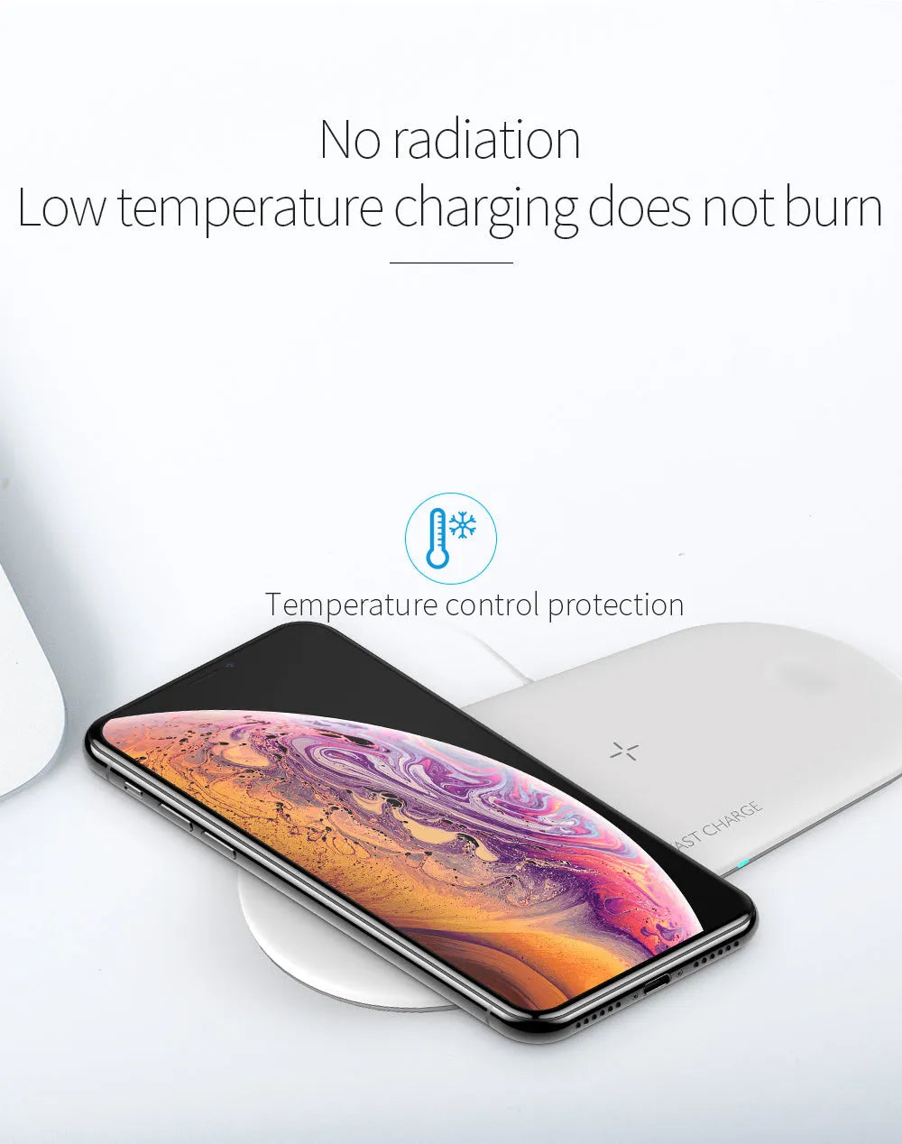 Black three-in-one wireless charging station for iPhone, Apple Watch and headphones on a desk.