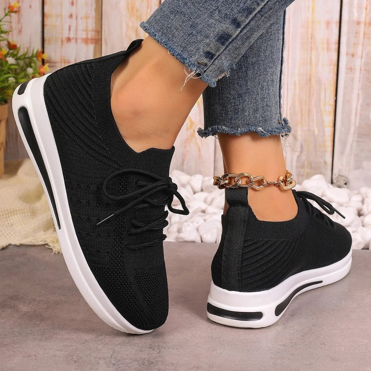 Women's fly-knit casual sneakers in black blue and red with artificial PU upper and low top design
