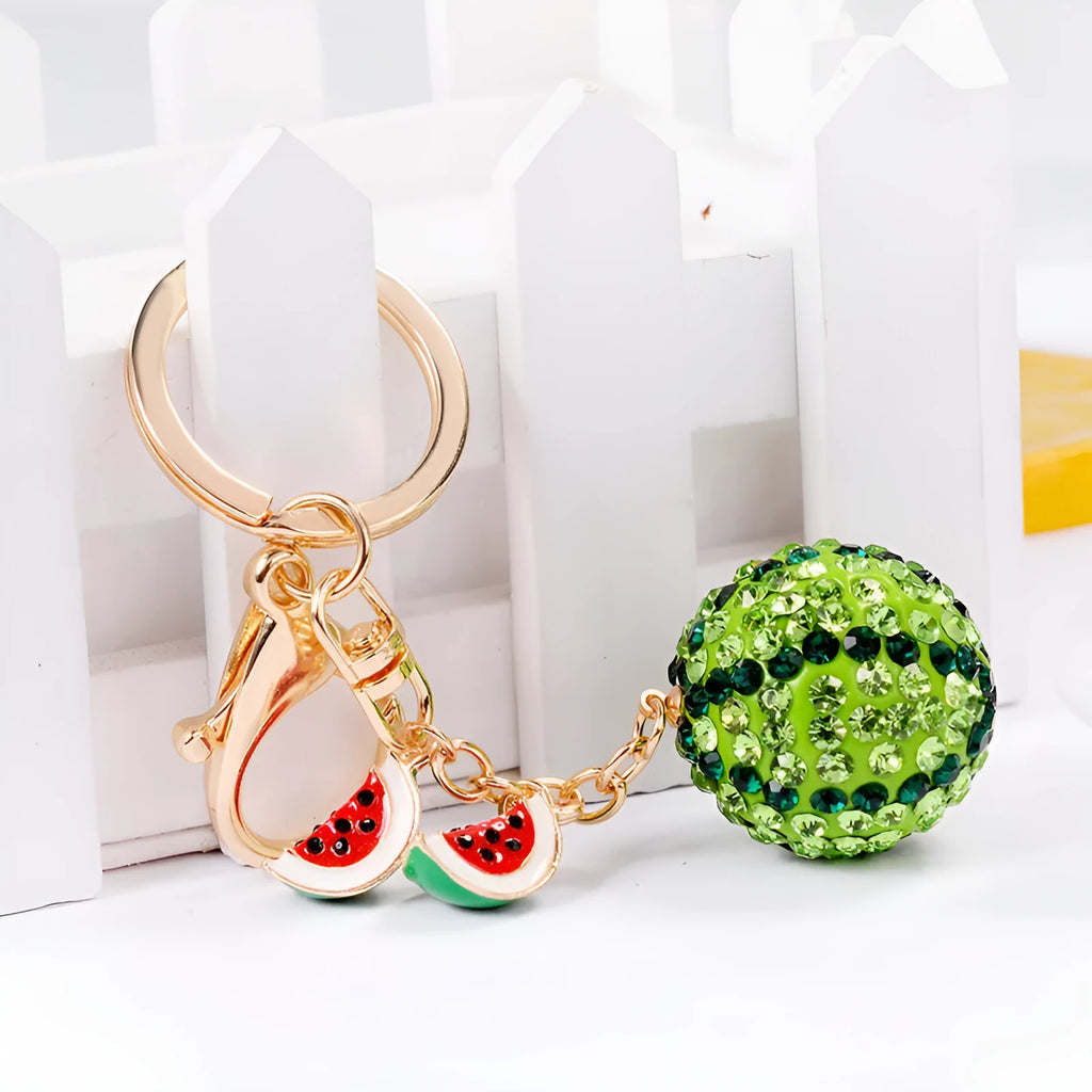 Green zinc alloy watermelon-shaped keychain on a keyring, showing detailed fruit slice design.