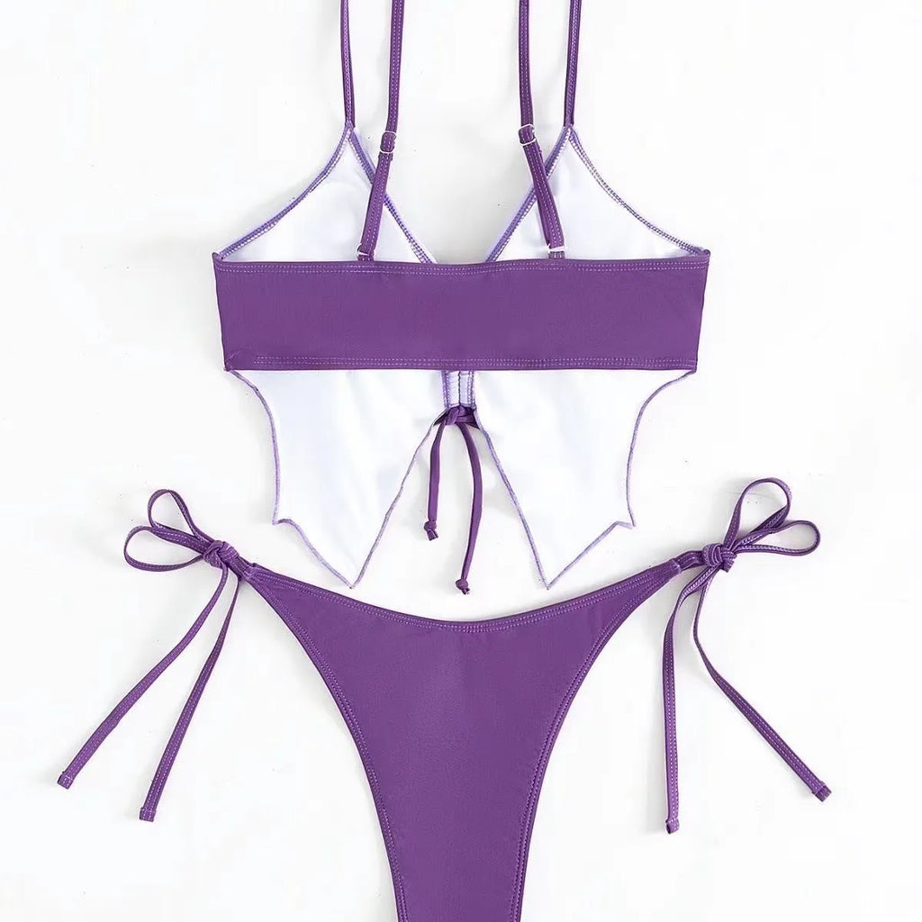 Women's purple split bow back bikini swimsuit set on mannequin, showing sleeveless top and briefs.